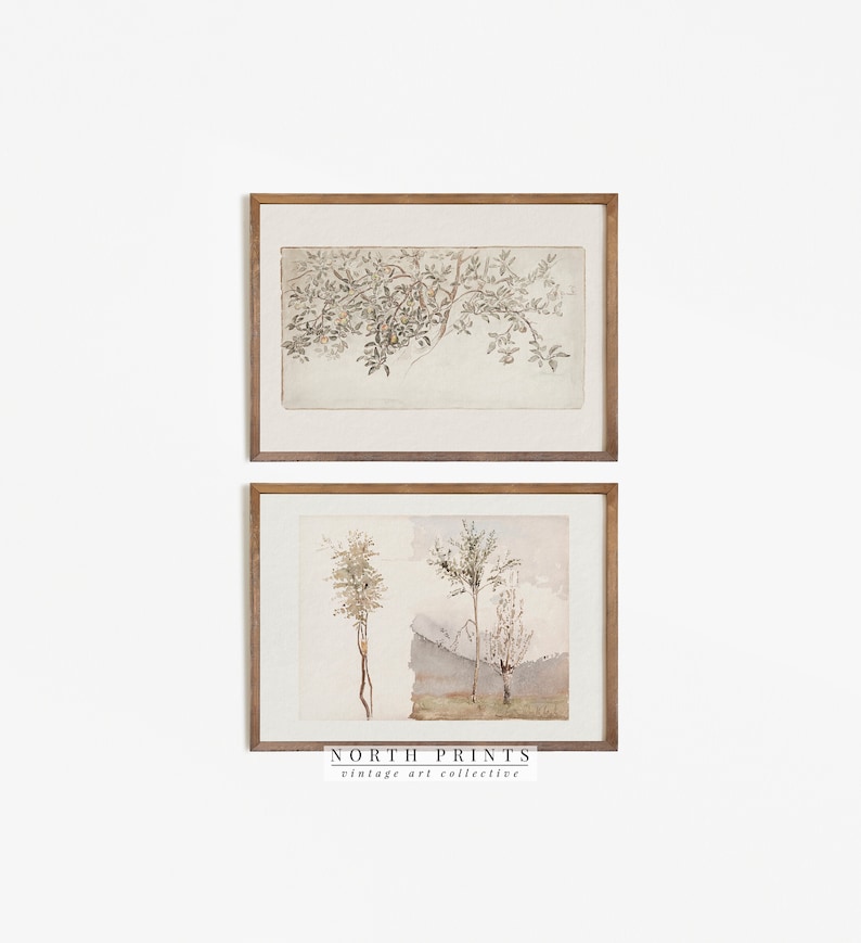 May include: Two framed watercolor prints of trees and branches. The top print shows a branch with leaves and fruit. The bottom print shows three trees with a light blue background. The prints are framed in a light brown wood frame. The bottom print has the text "NORTH PRINTS vintage art collective" at the bottom.