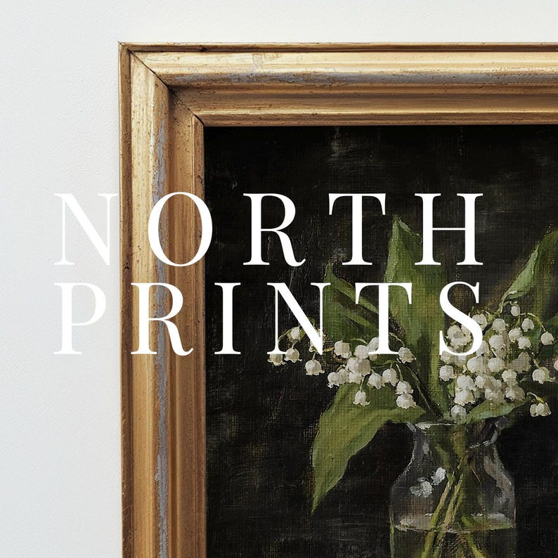 May include: A framed painting of a bouquet of white lilies in a clear glass vase. The painting is set against a dark green background. The frame is gold with a distressed finish. The text "NORTH PRINTS" is visible in the image.