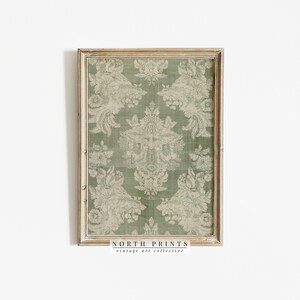 May include: A framed print of a vintage green and white damask pattern. The print is in a light wood frame with a white background. The text "NORTH PRINTS vintage art collective" is at the bottom of the print.