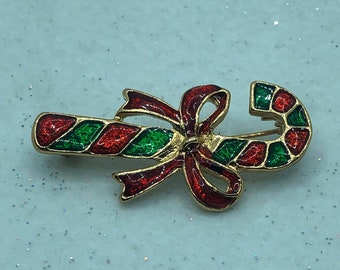 Broche de bastón de caramelo vintage: Pin navideño esmaltado en tono dorado
