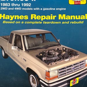 May include: A Haynes Repair Manual for Ford Ranger & Bronco II models from 1983 to 1992. The cover features a tan pickup truck with its hood open, revealing the engine. The manual includes essential information for today's more complex vehicles.