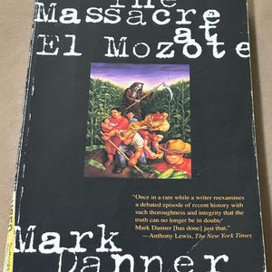 May include: A hardcover book titled "The Massacre at El Mozote" by Mark Danner. The cover is black with white text and a central illustration depicting figures in a field with a grim reaper. Includes a quote from The New York Times.