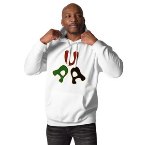 May include: White hoodie with a graphic of the letters "UPA" in red, green, and black. The letters are stylized and have a gold outline.