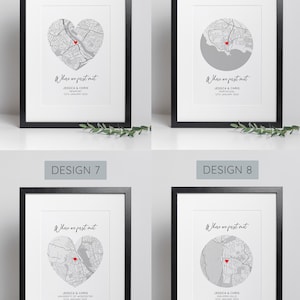 May include: Four framed prints with black frames. Each print features a gray map design with a red heart marking a location. The text "Where we first met" is above the names and date. Designs 5, 6, 7, and 8 are displayed.