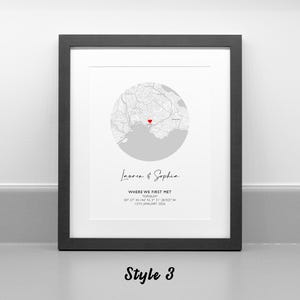 May include: A framed wall art print featuring a circular map of Torquay with a red heart icon marking a specific location. Below the map, the text reads Lauren & Sophia, WHERE WE FIRST MET, TORQUAY, 50 27 44.14N 3 31 38.92W, 12TH JANUARY 2019.