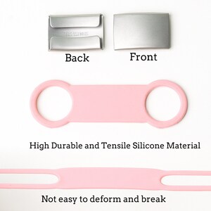 K&ouml;nnte beinhalten: Rosa Silikonband mit zwei Schlaufen, das strapazierf&auml;hig und verformungsbest&auml;ndig ist. Das Band wird gedehnt gezeigt, um seine Flexibilit&auml;t zu demonstrieren. Der Text "High Durable and Tensile Silicone Material" und "Not easy to deform and break" ist unterhalb des Bandes sichtbar.