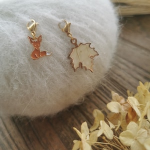 Crochet stitch markers: fox and maple leaf