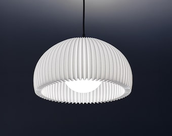 May include: A white pendant light featuring a dome-shaped shade with vertical pleats. The fixture is suspended by a thin black cord attached to a matching black circular ceiling canopy, with a glowing light bulb visible inside the shade.