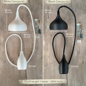 Peut inclure: Deux kits de pavillon de plafond, un blanc et un noir, comprenant chacun une coupelle de 80 mm de diam&egrave;tre, une douille de 105 mm de hauteur et un cordon de 1 m&egrave;tre. Chaque kit inclut le mat&eacute;riel de fixation et est compatible avec des ampoules E27/A19.
