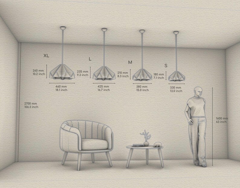 May include: Four sizes of a white, origami-style pendant light fixture hanging from the ceiling. The pendant lights are labeled XL, L, M, and S. Measurements in inches and millimeters are provided for each size. A person stands next to the smallest size pendant light. A chair and a small table are in the foreground.