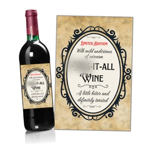 May include: A red wine bottle with a label that reads "Limited Edition" and "Drink-It-All Wine". The label has a black and white ornate frame and the text is in a black font. The label says "With mild undertones of sarcasm. A little bitter and definitely twisted."