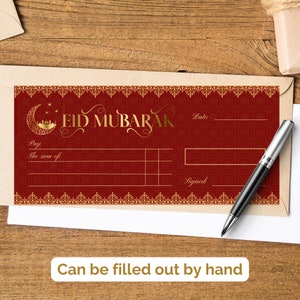 May include: A red and gold Eid Mubarak gift card with a crescent moon and star design. The card has a space to write the amount of money being gifted, the date, and a signature.