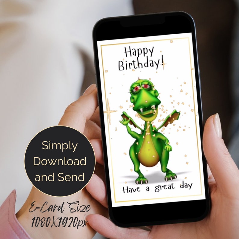 A birthday animated digital eCards with a cute green cartoon dragon with red eyes and a toothy grin is on a white background with gold confetti. The text on the card reads 'Happy Birthday!' and 'Have a great day.' The card is displayed on a smartphone screen.