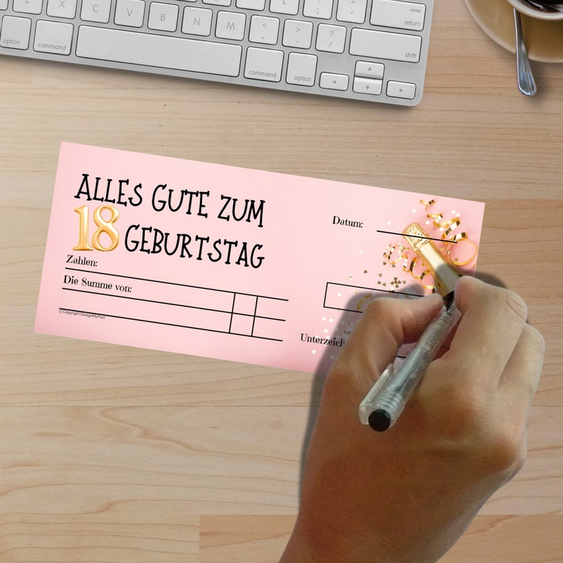 May include: Pink and white gift certificate with gold lettering that says "Alles Gute zum 18 Geburtstag". The certificate has a space for the date, amount, and signature.