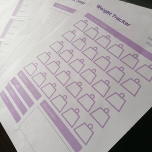 May include: A printable weight tracker with 30 days of weight tracking spaces. The tracker has a purple outline and is designed to help people track their weight loss journey.