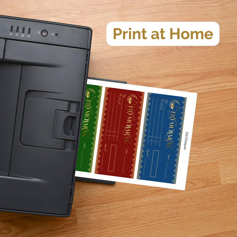 May include: A printer printing out three Eid Mubarak gift certificate templates. The templates are in green, red, and blue with gold accents. The text "Print at Home" is visible above the printer.