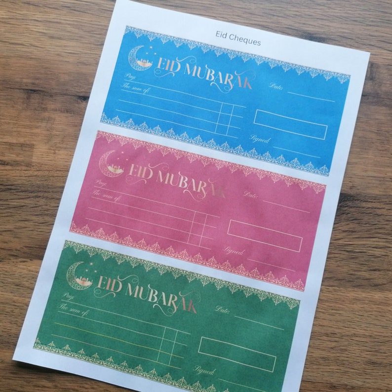 May include: Three printable Eid Mubarak gift certificate templates. The templates are blue, pink, and green with gold accents and a crescent moon design. Each template has a space to write the amount of the gift, the date, and a signature.