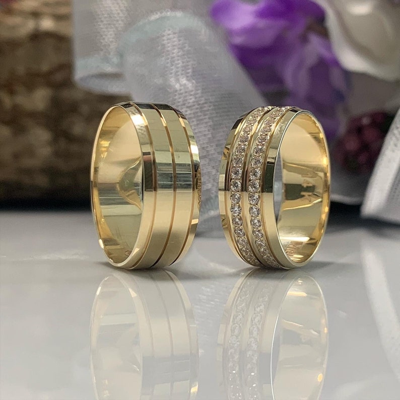Image of 14k Gold Wedding Bands Set

A close-up of a stunning 14k gold wedding bands set, crafted with exquisite detail and featuring a unique design that symbolizes the everlasting love and connection between two souls.