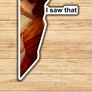 May include: A close-up of a painting of a person wearing a red robe and a gold necklace. The text "I saw that" is written on a white speech bubble.