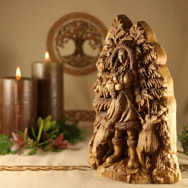 May include: A wooden carving of a woman standing in a forest, surrounded by trees and animals. The carving is detailed and intricate, with the woman's clothing and the trees' branches clearly visible. The carving is a beautiful example of traditional woodcarving.