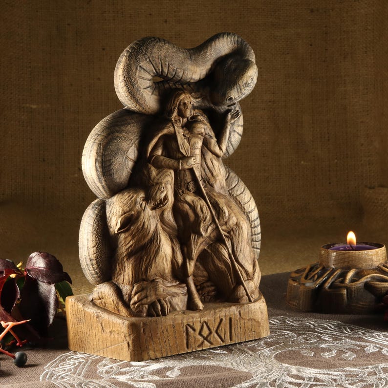 May include: A wooden carving of a Norse goddess riding a wolf, with a serpent wrapped around her. The carving is detailed and intricate, with a runic inscription at the base.