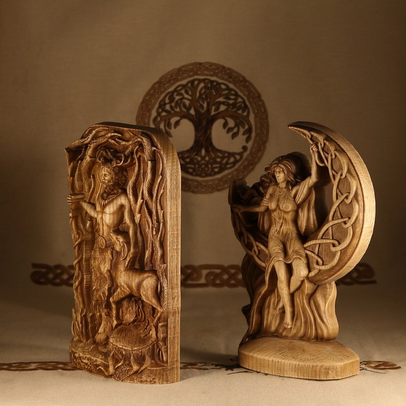 May include: Two wooden carvings depicting figures from Celtic mythology. The first carving shows a horned god standing in a forest, while the second carving shows a goddess sitting on a crescent moon.