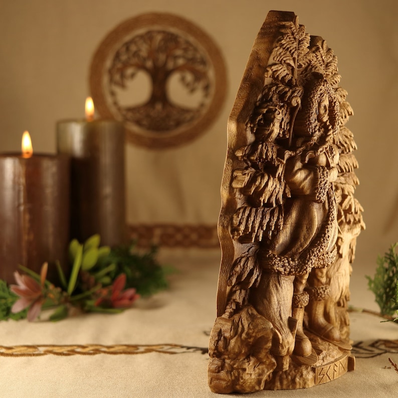 May include: A wooden carving of a figure standing in a forest, surrounded by trees. The carving is detailed and intricate, with the figure's clothing and the trees' branches and leaves all carved with precision. The carving is a beautiful example of the art of wood carving.