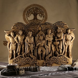 May include: A wooden sculpture depicting eight figures, possibly Norse gods, standing in front of a throne. The figures are carved in detail and have intricate designs. The sculpture is painted in shades of brown and beige.