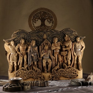 May include: A wooden sculpture depicting a group of figures, possibly Norse gods, seated on a throne with a tree of life design above them. The figures are carved in detail and have a rustic, aged appearance.