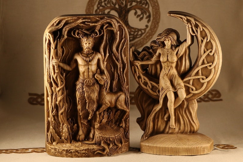 May include: Two wooden carvings depicting figures from Celtic mythology. The first carving shows a horned god standing in a forest, holding a staff and accompanied by a deer. The second carving shows a goddess standing on a crescent moon, her arms outstretched.