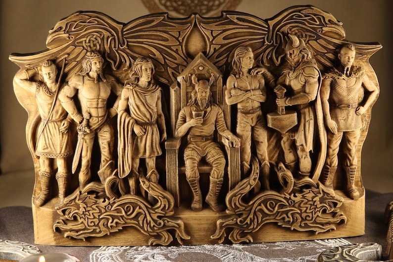 May include: A wooden carving depicting nine figures from Norse mythology. The figures are carved in relief and are arranged in a semi-circle around a central figure. The central figure is Odin, the god of wisdom, war, and death. He is seated on a throne and holding a drinking horn. The other figures are Thor, the god of thunder; Freya, the goddess of love and beauty; Heimdall, the watchman of the gods; Loki, the trickster god; Baldr, the god of light; Hodr, the god of darkness; and the two wolves, Geri and Freki.