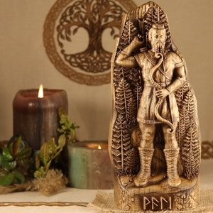 May include: A wooden carving of the Norse god,  Pan, holding a bow and arrow. The carving is detailed and intricate, with a rustic finish. The carving is standing on a wooden base with the word "PAN" inscribed in runes.