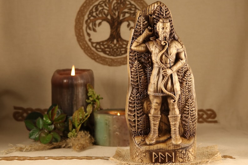 May include: A wooden carving of the Norse god,  Pan, holding a bow and arrow. The carving is detailed and intricate, with a rustic finish. The carving is standing on a wooden base with the word "PAN" inscribed in runes.