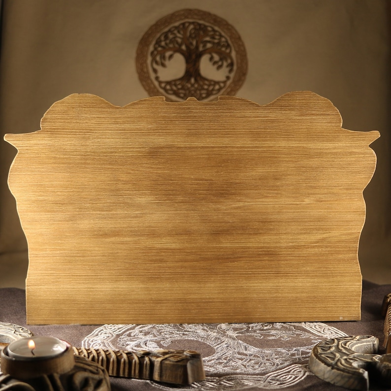 May include: A wooden sign with a carved design, featuring a light brown wood grain. The sign is blank and ready for personalization.