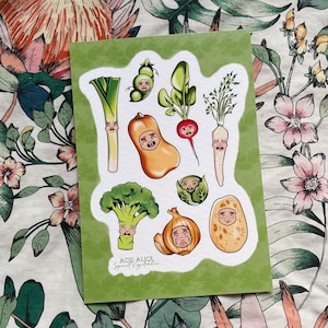 May include: A set of colorful stickers featuring various vegetables with cartoon faces. The stickers are on a green background with the text "Acid Alice Spirit Vegetables".
