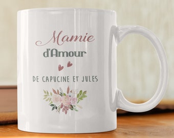 May include: White ceramic mug with a floral design and the text "Mamie d'Amour de Capucine et Jules".