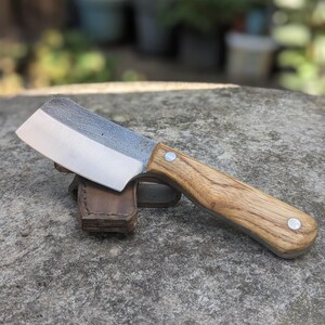 Handmade 17 cm fulltang cleaver with Ash Wood handle and leather sheath.