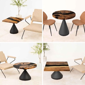 May include: A collection of modern side tables with wooden tops and black bases. The tables have either square or round tops with a dark, resin-filled design. The bases are a cone shape. Chairs are in the background.