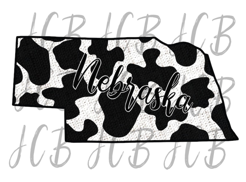 May include: A black and white cow print design fills the outline of the state of Nebraska. The word "Nebraska" is written in a cursive font across the center of the state outline.