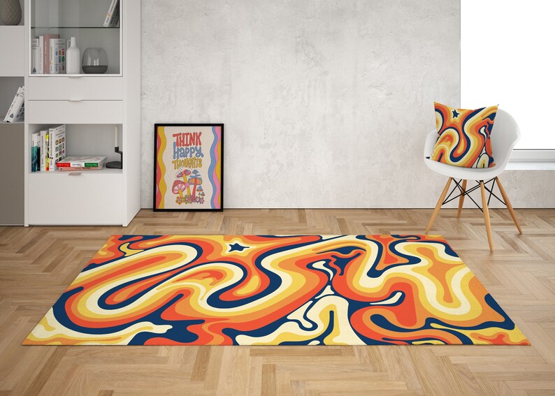 May include: A retro-style rug with a swirling pattern in shades of orange, yellow, blue, and white. The rug is on a wooden floor with a white wall and a framed poster that says "Think Happy Thoughts" with a mushroom illustration.