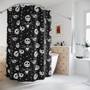 May include: Black and white shower curtain with a repeating pattern of Jack Skellington's face from the Nightmare Before Christmas movie. The background is black with white stars.