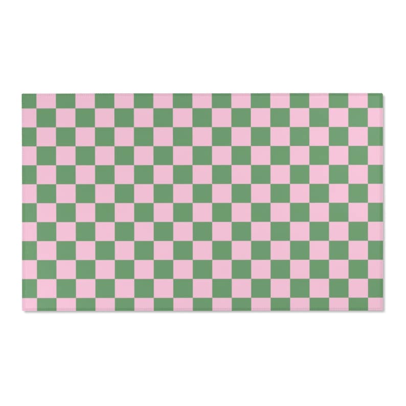 Puede incluir: Una alfombra de patr&oacute;n a cuadros con cuadrados alternos de rosa y verde.
