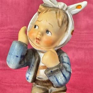 May include: A set of three ceramic mugs with a speckled, matte finish. The mugs are in shades of cream, light gray, and dark gray. Each mug has a simple, minimalist design, perfect for coffee or tea.