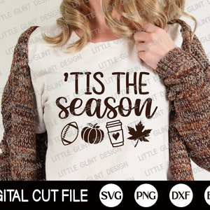 May include: A white t-shirt featuring the text "'Tis the Season" in dark brown, accompanied by football, pumpkin, coffee cup, and leaf illustrations. The words "Digital Cut File" are at the bottom, with SVG, PNG, DXF, and EPS icons.