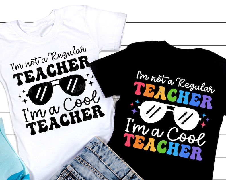 May include: Two t-shirts with the text "I'm not a regular teacher, I'm a cool teacher" in black text with rainbow accents on the black shirt. Both shirts feature a pair of sunglasses.