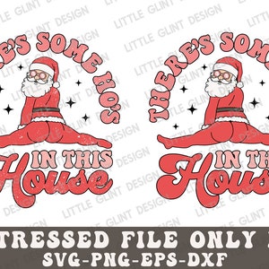 May include: A distressed, vintage-style graphic design featuring a Santa Claus in a red suit with a white beard, doing a split with the text "There's some ho's in this house".