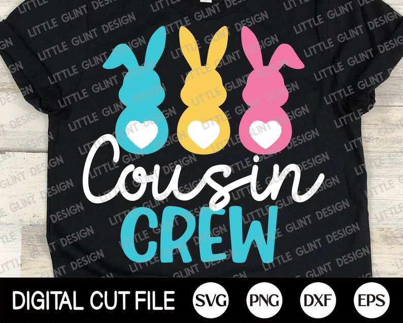 May include: A black t-shirt featuring a design of three Easter bunny silhouettes in blue, yellow and pink. The bunnies have hearts on their chests. The text "Cousin Crew" is written in white with a blue outline.