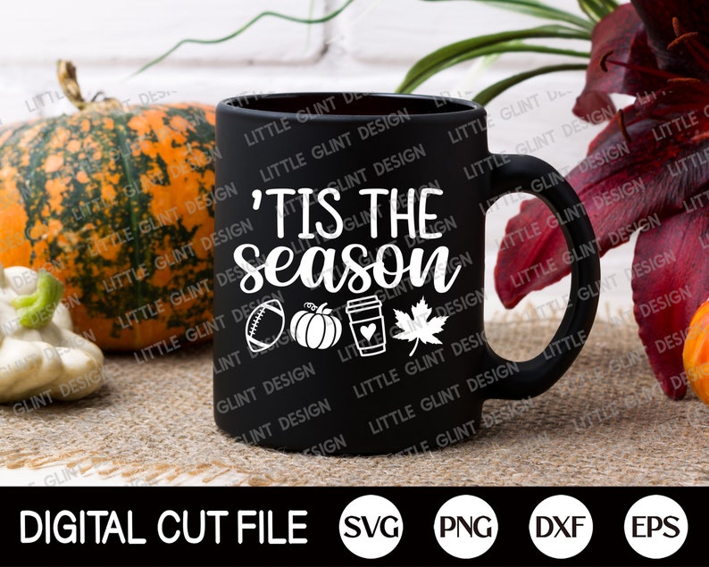 May include: A black ceramic mug with the text "'Tis the season" and autumn-themed graphics, including a football, pumpkin, coffee cup, and maple leaf. The words "Digital Cut File" and file type icons are at the bottom.