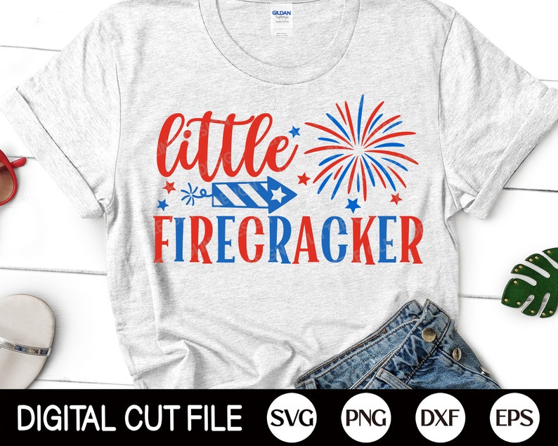 May include: A white t-shirt with the text "little firecracker" in red and blue. A red, white, and blue firework graphic is above the text. The text "DIGITAL CUT FILE" is at the bottom of the image, along with the file types SVG, PNG, DXF, and EPS.
