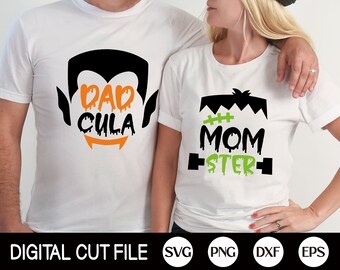 May include: Two white t-shirts with a Halloween theme. The shirt on the left has a black silhouette of a vampire with the text "Dad Cula" in orange. The shirt on the right has a black silhouette of Frankenstein's monster with the text "Mom Ster" in green.